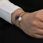 دستبند دست ساز مروارید دفرمه